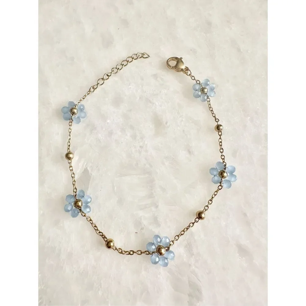 Delicate light blue beaded flower chain bracelet
